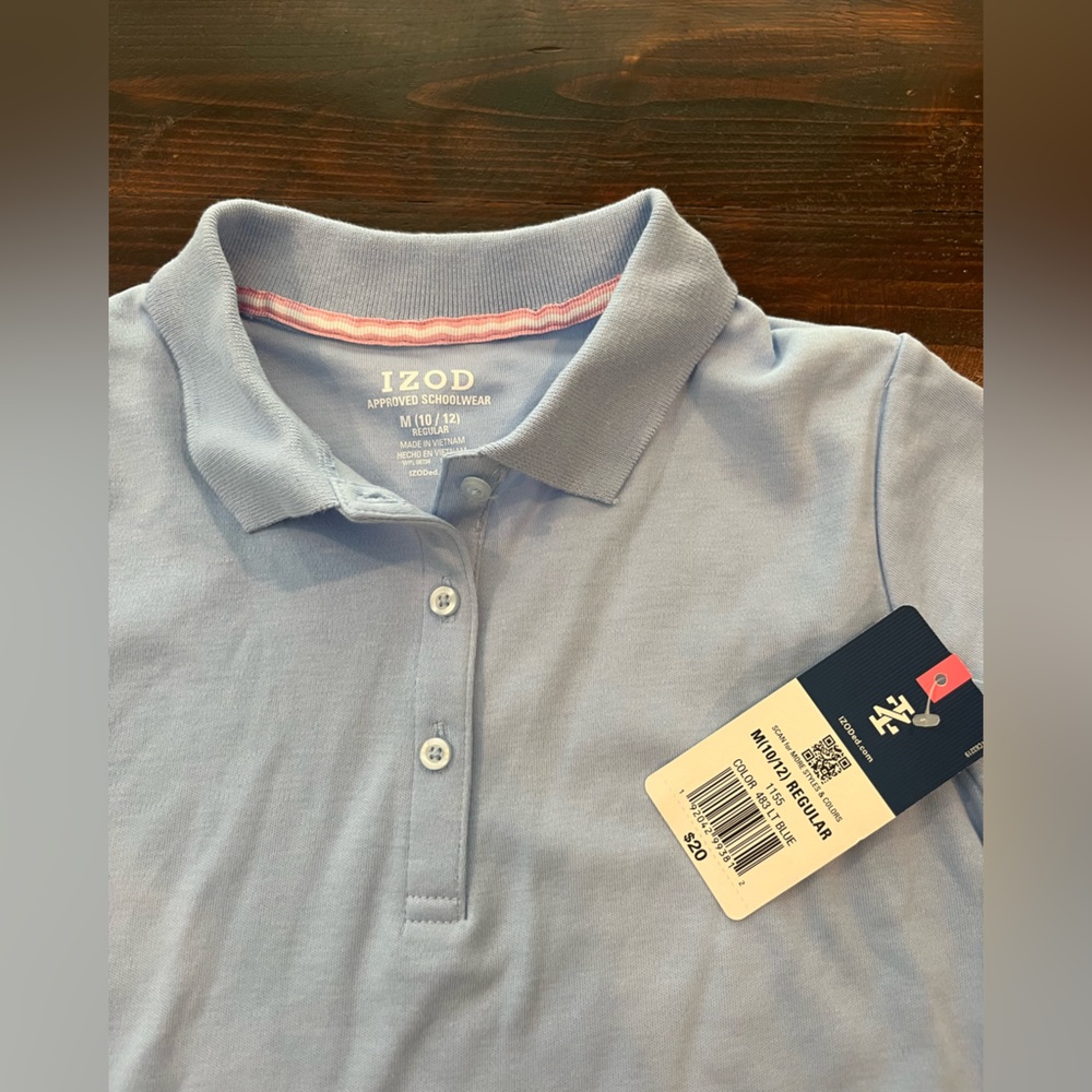 Girls light blue polo. Izod brand. Size medium 10–12.